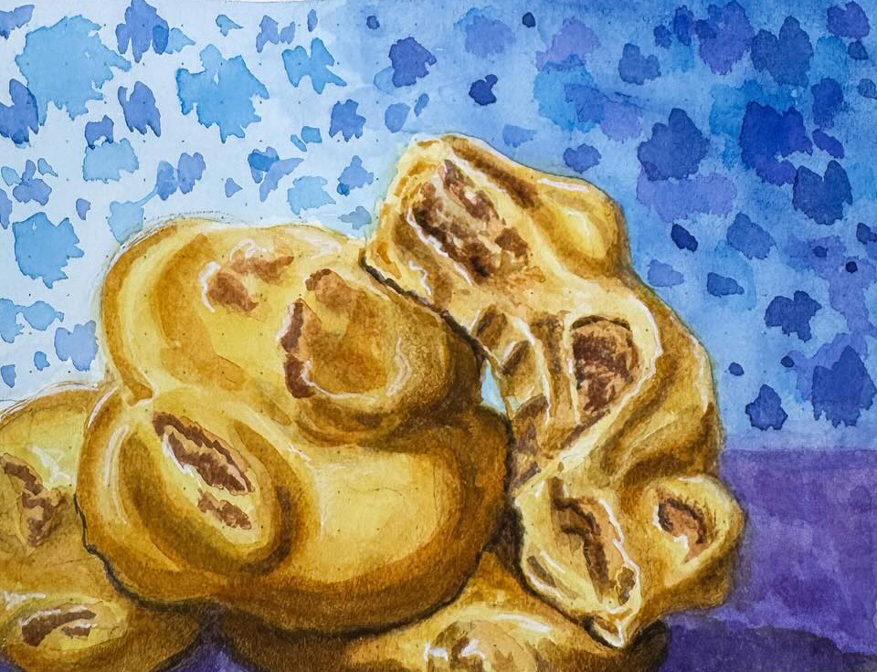 Close-up of a watercolor praline, highlighting the detailed caramel texture and embedded pecans in vibrant hues.